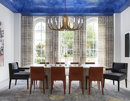 Large dining room with seating for ten. Magnificent blue ceiling and three large arched windowns with floor to ceiling curtains in Houston, TX